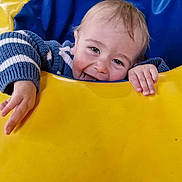 Elijah Blue is registered to the contest to win money with this photo: blue, child, cute, expression, face, fun, hands, happy, head, joy, outdoor_play, play, playground, portrait, smiling, striped_clothing, sweater, toddler, yellow, young_child