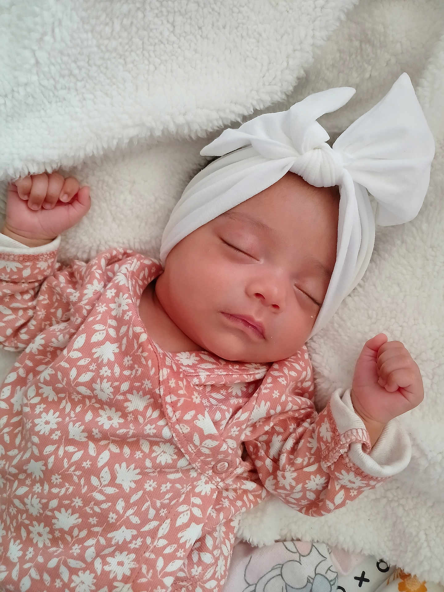 Heavanly is registered to the contest to win money with this photo: baby, sleeping, infant, headband, bow, floral_clothing, pink, white, blanket, soft, peaceful, closeup, portrait, cute, resting, newborn, child, face, hand, cozy
