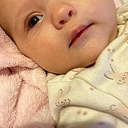 Shelbyrose joined the competition — help win amazing prizes! baby, face, closeup, blanket, soft, infant, onesie, cute, skin, expression, lying_down, newborn, child, sleepwear, indoors, portrait, head, young, pink, comfort