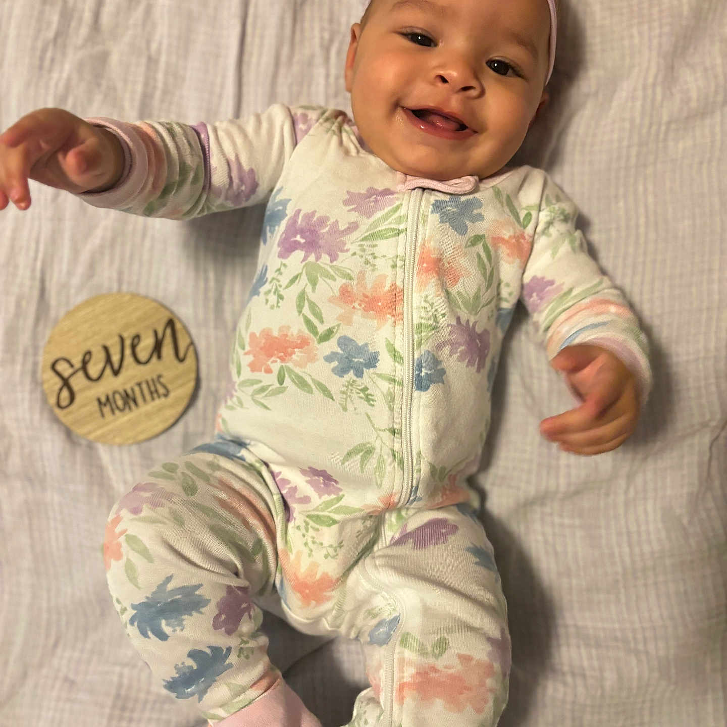 Indigo is registered to the contest to win money with this photo: applique, baby, babylaughing, bodypart, cap, clothing, face, finger, hand, happy, hat, head, newborn, pajamas, pants, pattern, person, photography, portrait, smile