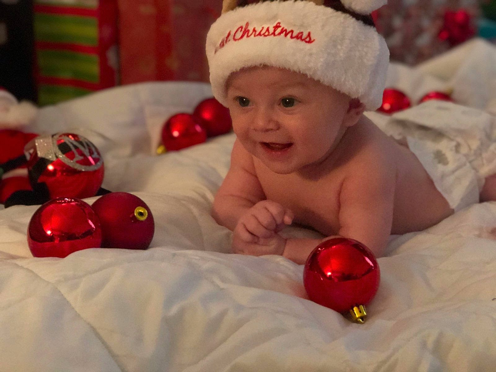 Marco joined the competition — help win amazing prizes! baby, child, christmas, christmas_eve, christmas_ornament, head, headwear, holiday, holiday_ornament, joy, ornament, person, red, smile, toddler
