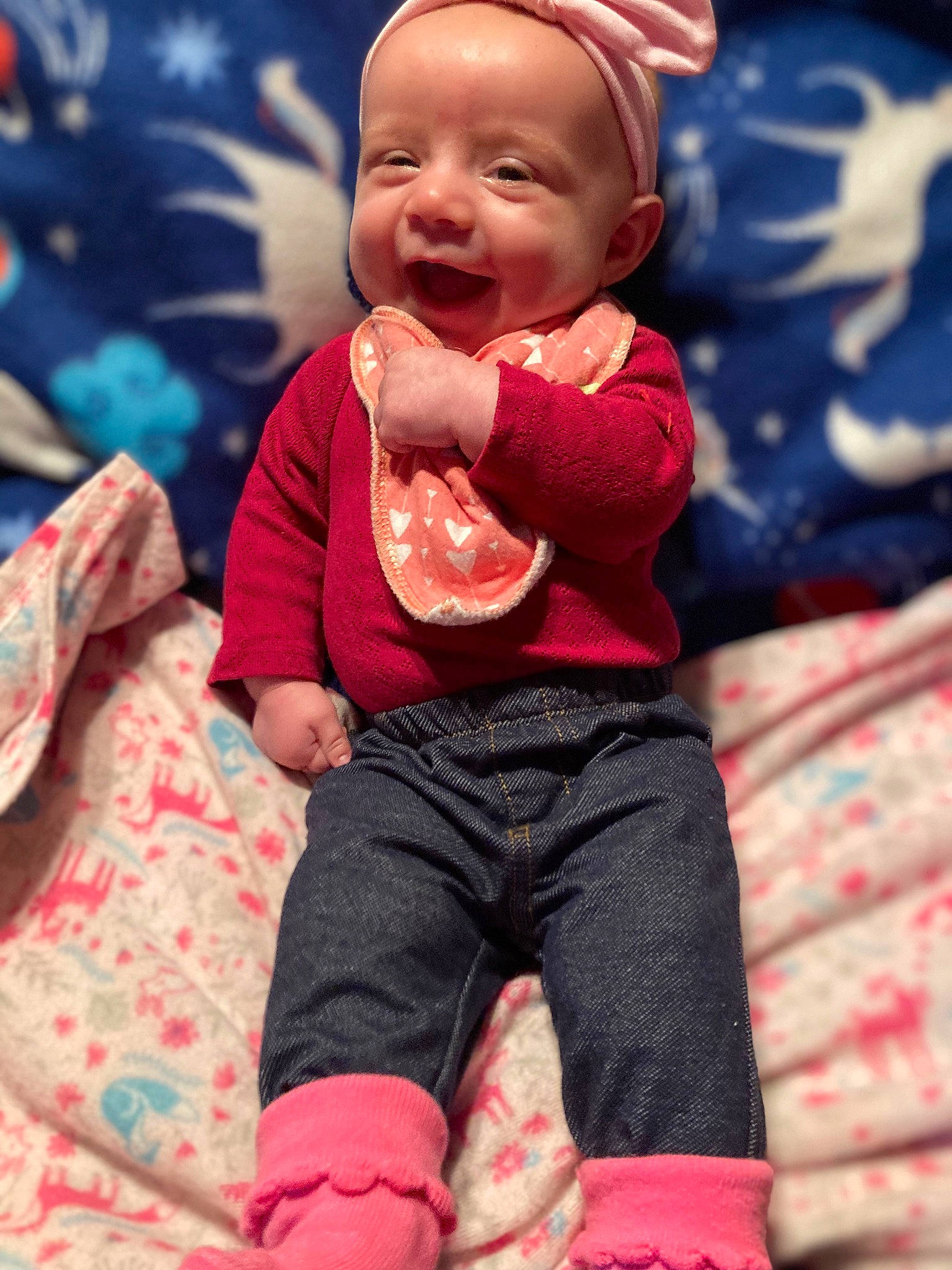 Jessica is registered to the contest to win money with this photo: arm, baby, baby_toddler_clothing, cheek, eye, face, hand, happy, head, human_body, jeans, outerwear, person, pink, product, skin, sleeve, smile, standing, t_shirt