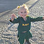 casual, cheerleader, child, cute, daylight, girl, gravel, green_uniform, happy, joyful, outdoor, person, pigtails, playful, pose, shoes, short_hair, smiling, sunlight, yellow_hair_accessories