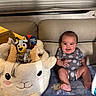 Kinsley is registered to the contest to win money with this photo: animal_shaped_basket, baby, blanket, celebration, child, couch, cute, easter_basket, face, happy, home, indoor, onesie, person, plush, sitting, smiling, social_media_post, toy, window_blinds