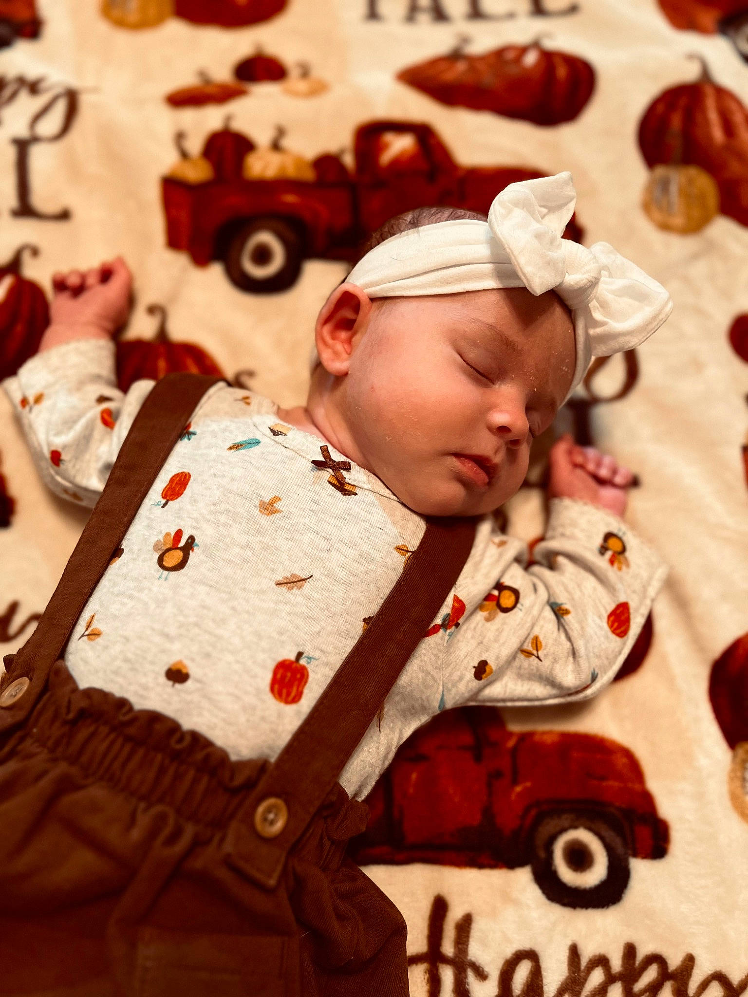 Hadleigh is registered to the contest to win money with this photo: art, baby, baby_products, baby_safety, baby_toddler_clothing, bed_sheet, bedding, bedtime, child, comfort, flooring, headwear, linens, pattern, person, room, sitting, textile, tire, toddler