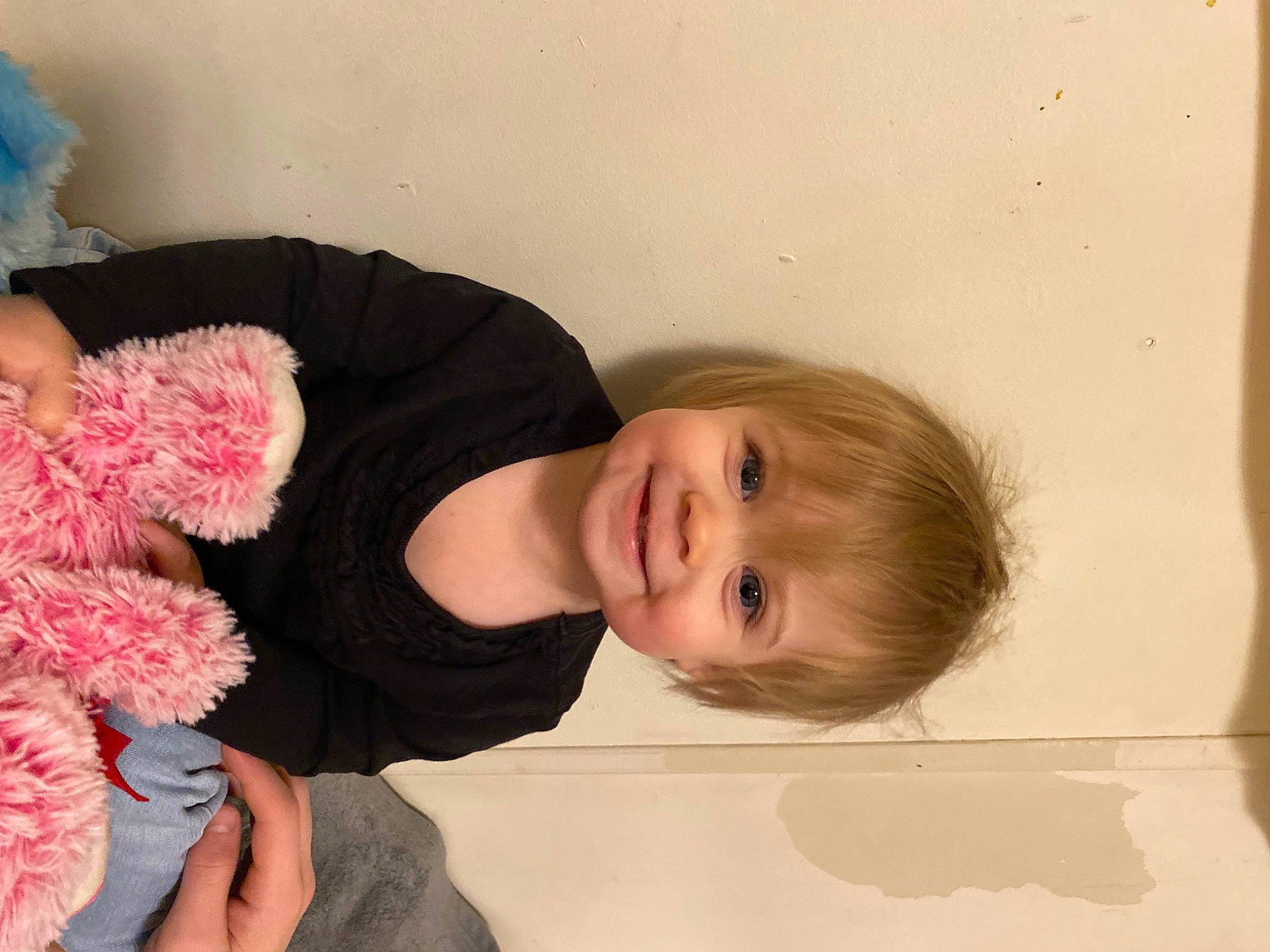 Kinnley is registered to the contest to win money with this photo: baby_toddler_clothing, child, cut_flowers, fashion_accessory, finger, flooring, flower, fun, hair_accessory, happy, joy, peach, person, petal, plant, room, smile, teddy_bear, toddler, toy