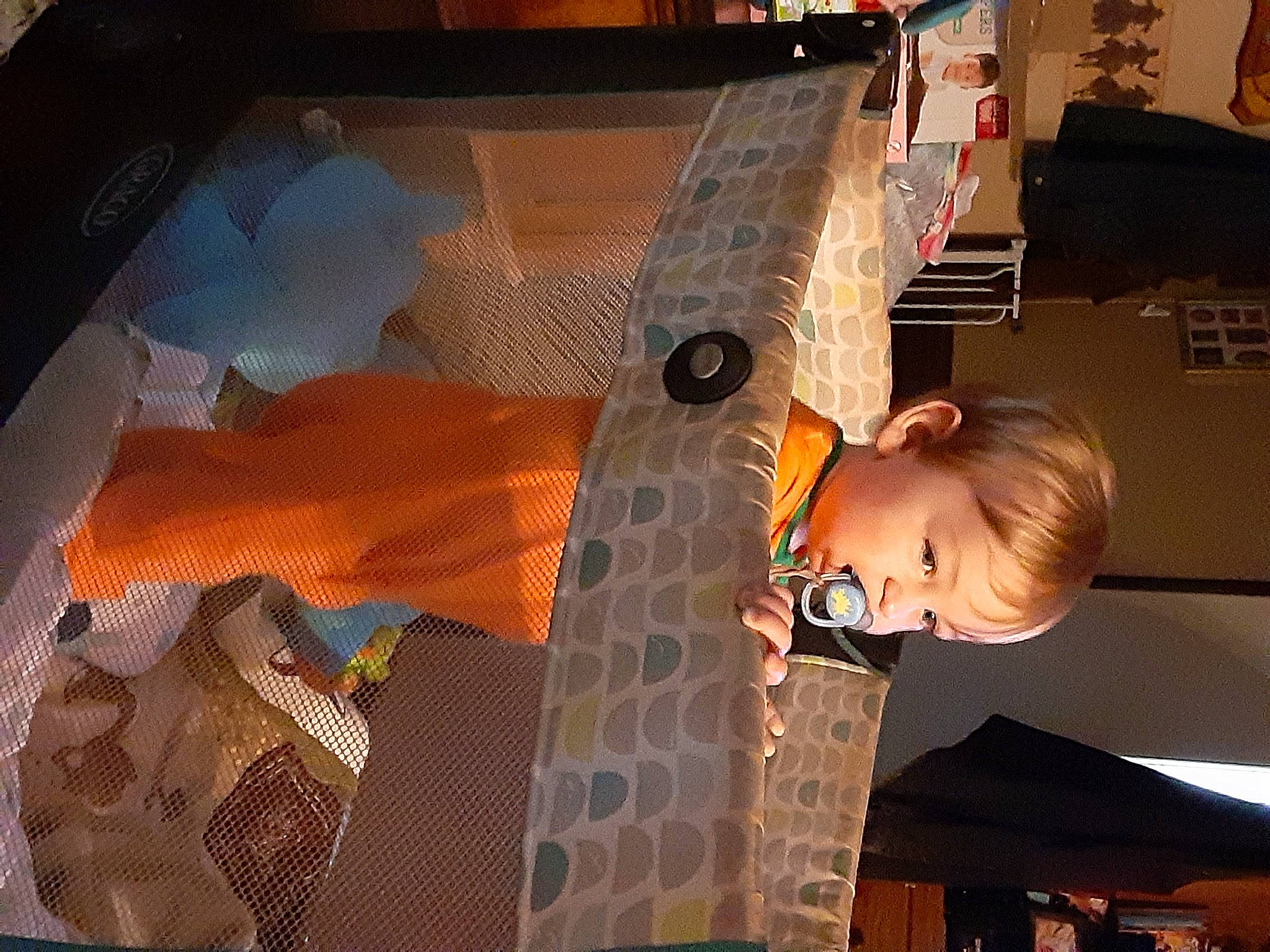 Brantley is registered to the contest to win money with this photo: art, artist, automotive_design, ceiling, flooring, fun, glass, leisure, machine, orange, painting, pattern, person, room, space, string_instrument, tints_and_shades, toddler, vehicle_door, visual_arts