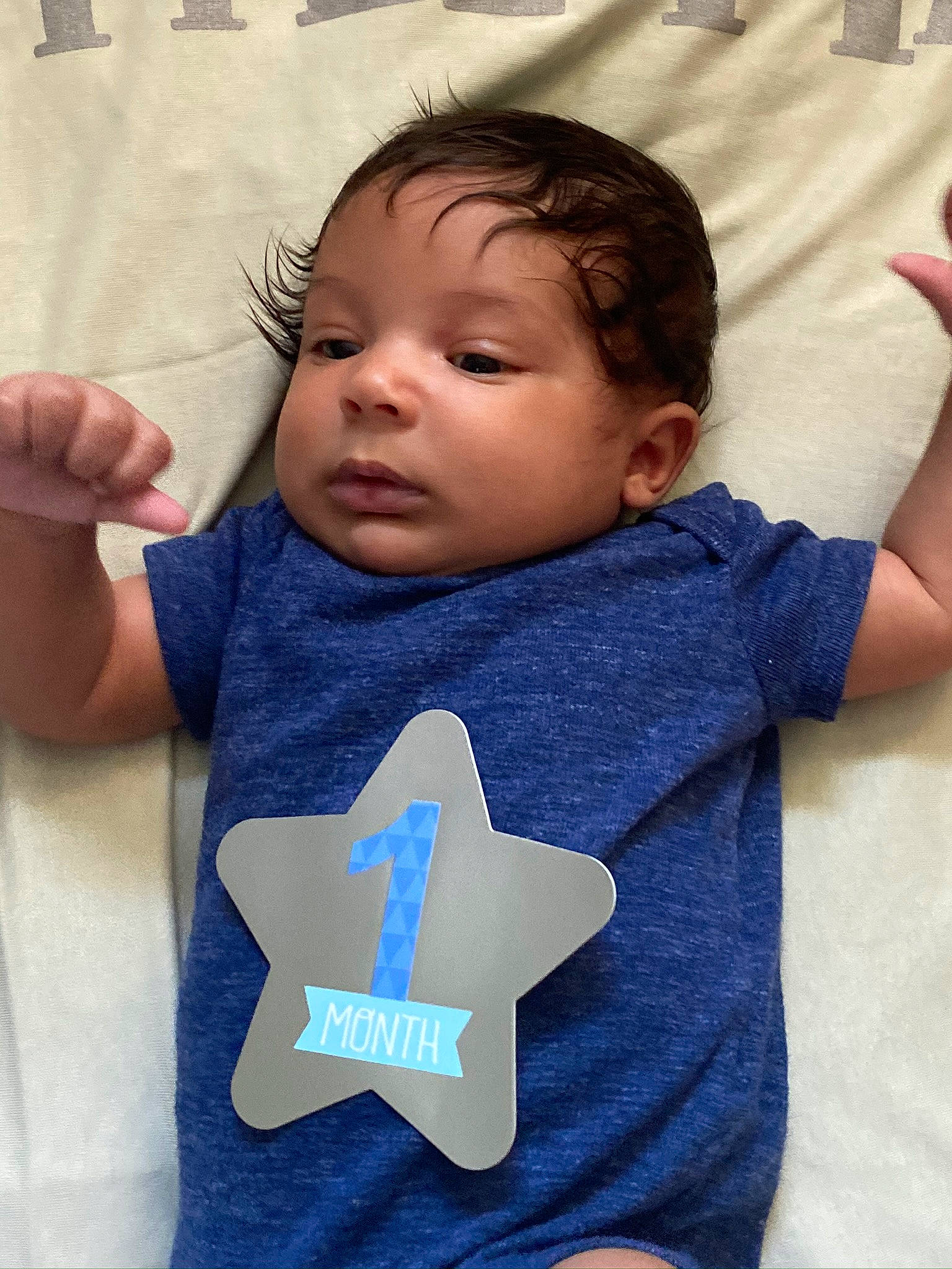 Tobias is registered to the contest to win money with this photo: arm, baby, baby_products, baby_toddler_clothing, blue, cheek, child, ear, finger, hand, head, neck, nose, person, product, skin, sleep, sleeve, t_shirt, textile