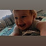 Alistair Thatcher joined the competition — help win amazing prizes! baby, child, infant, smiling, laughing, face, portrait, candid, indoor, home, crawling, reaching, blond_hair, white_shirt, close_up, happy, playful, carpet, furniture, photography
