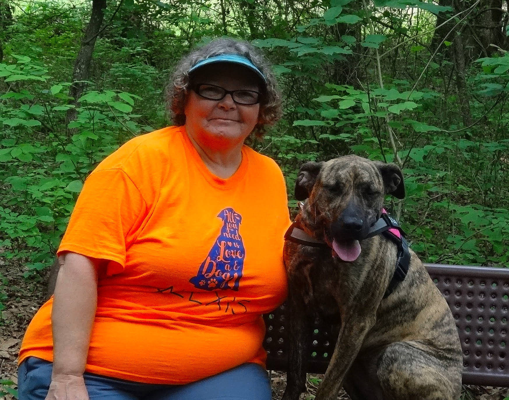 Alexis is registered to the contest to win money with this photo: adventure, canidae, carnivore, companion_dog, dog, dog_breed, dog_hiking, fawn, grass, hat, jeans, leisure, plant, recreation, smile, sporting_group, t_shirt, tree, wildlife, working_animal