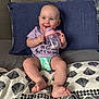 Isla-Mae joined the competition — help win amazing prizes! baby, child, smiling, sippy_cup, bed, pillow, blanket, diaper, clothing, happy, cute, indoor, person, infant, sitting, face, foot, head, blue_eyes, pink