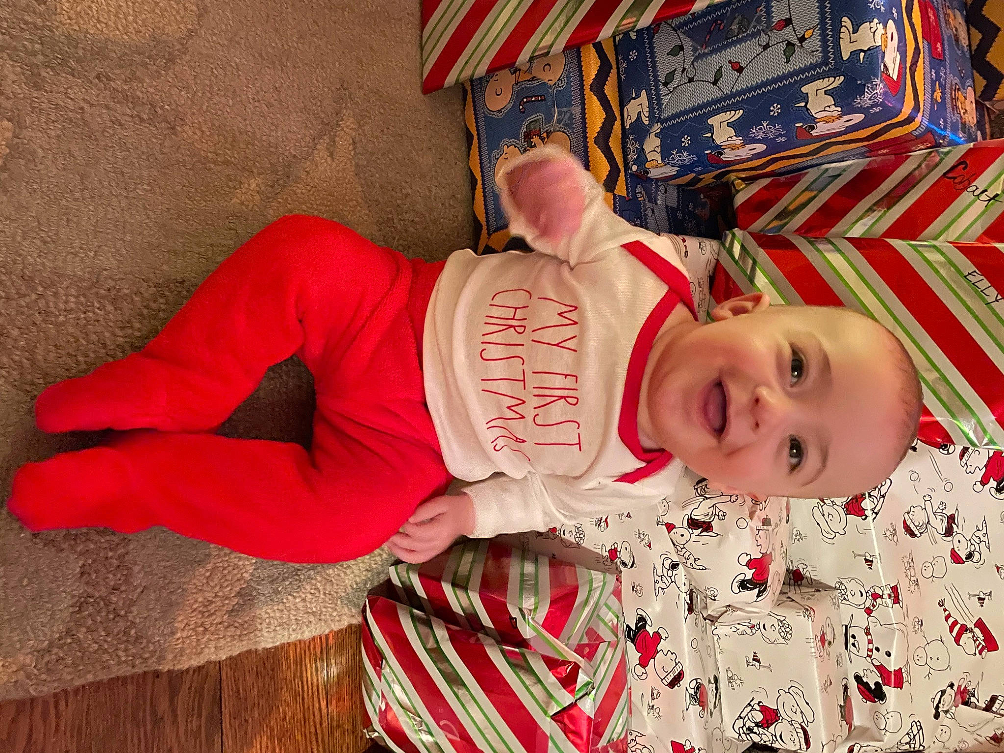 Jace joined the competition — help win amazing prizes! baby, baby_toddler_clothing, child, flooring, fun, happy, hat, magenta, pattern, person, room, sitting, sleeve, smile, t_shirt, toddler, tradition, tree, wood