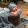Jaxson is registered to the contest to win money with this photo: newborn, baby, sleeping, towel, hat, wooden_bucket, blanket, cozy, cute, resting, infant, indoors, floor, soft_texture, wrapped, peaceful, portrait, baby_photography, child, adorable