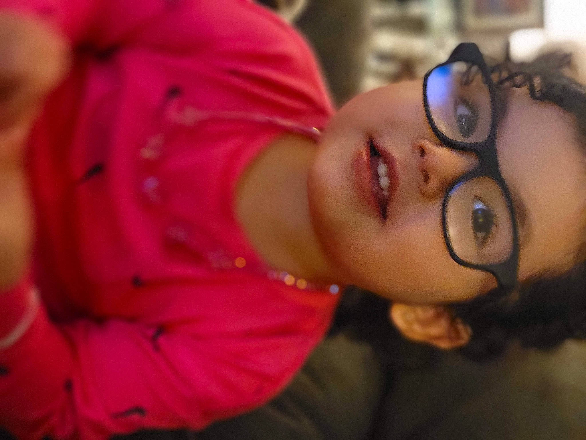 Adalyna is registered to the contest to win money with this photo: black_hair, cheek, ear, eyebrow, eyelash, eyewear, flash_photography, fun, glasses, happy, iris, lip, mouth, nose, person, plant, skin, smile, sunglasses, toddler