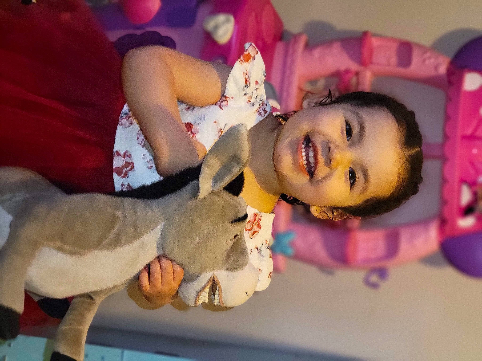 Adalyna is registered to the contest to win money with this photo: arm, black_hair, child, doll, dress, event, fashion_design, finger, fun, happy, joint, joy, leg, leisure, person, pink, plant, skin, smile, textile