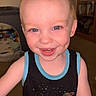 Ashten is registered to the contest to win money with this photo: toddler, child, smiling, blue_eyes, tank_top, space_design, indoor, home, carpet, toy, face, happy, person, short_hair, dimples, light_skin, portrait, cute, young_child, baby