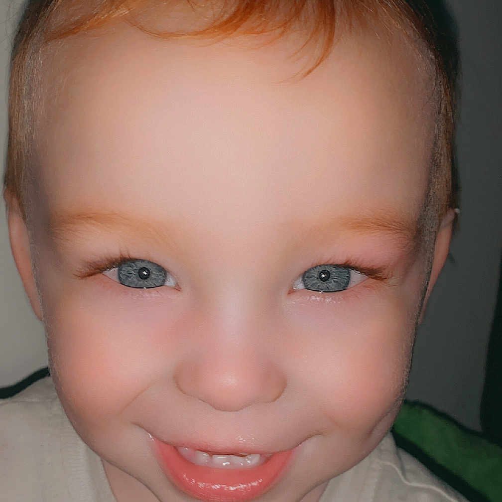 Ashten joined the competition — help win amazing prizes! child, toddler, smile, face, blue_eyes, red_hair, closeup, portrait, happy, cute, person, clothing, young_child, baby_teeth, eyelashes, skin, indoors, head, cheeks, youth