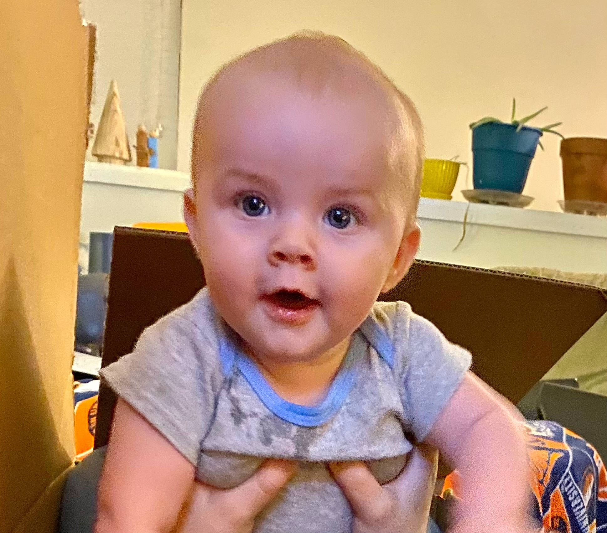 Kora is registered to the contest to win money with this photo: baby, baby_toddler_clothing, cheek, child, ear, eye, eyebrow, eyelash, finger, flooring, happy, iris, mouth, nose, person, skin, sleeve, smile, surprise, t_shirt