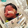 Khyaire joined the competition — help win amazing prizes! newborn, baby, hospital, blanket, swaddled, sleeping, nasal_tube, infant, crib, medical_tape, face, head, hair, healthcare, patient, cute, peaceful, child, indoors, rest