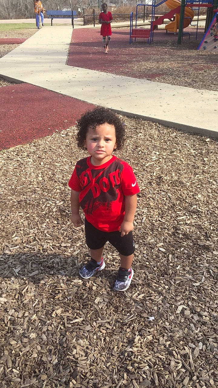 Elijah is registered to the contest to win money with this photo: asphalt, child, fun, leaf, leisure, person, plant, play, red, sky, smile, standing, toddler, tree, vacation