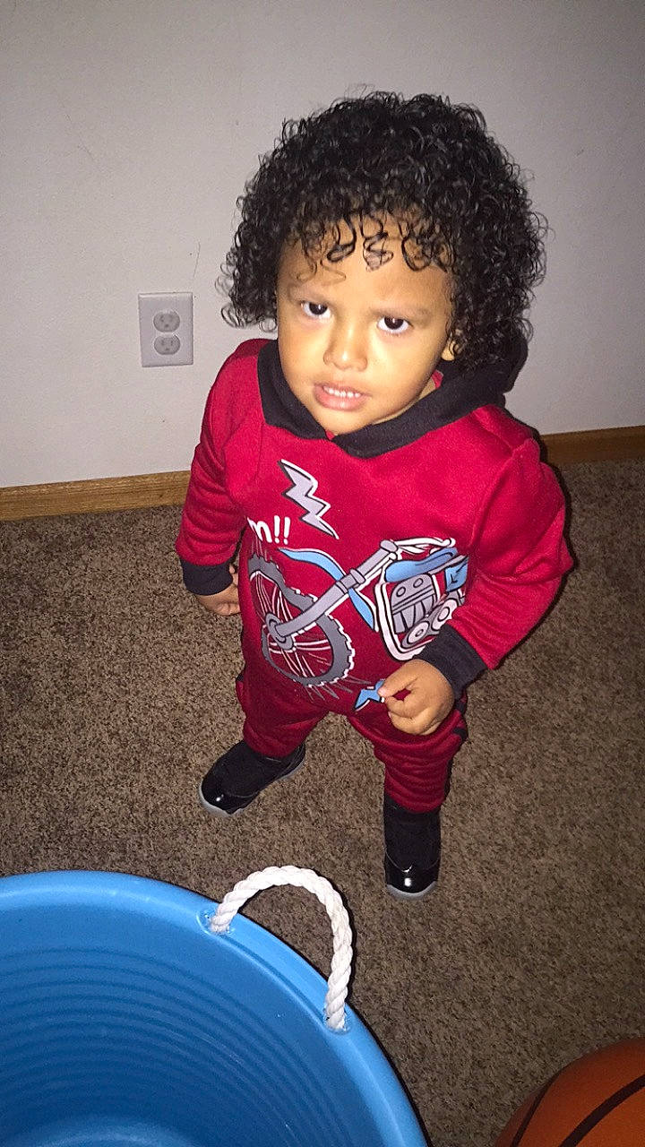 Elijah joined the competition — help win amazing prizes! afro, black_hair, cheek, child, cool, face, forehead, fun, hair, hairstyle, outerwear, person, play, smile, standing, t_shirt, toddler