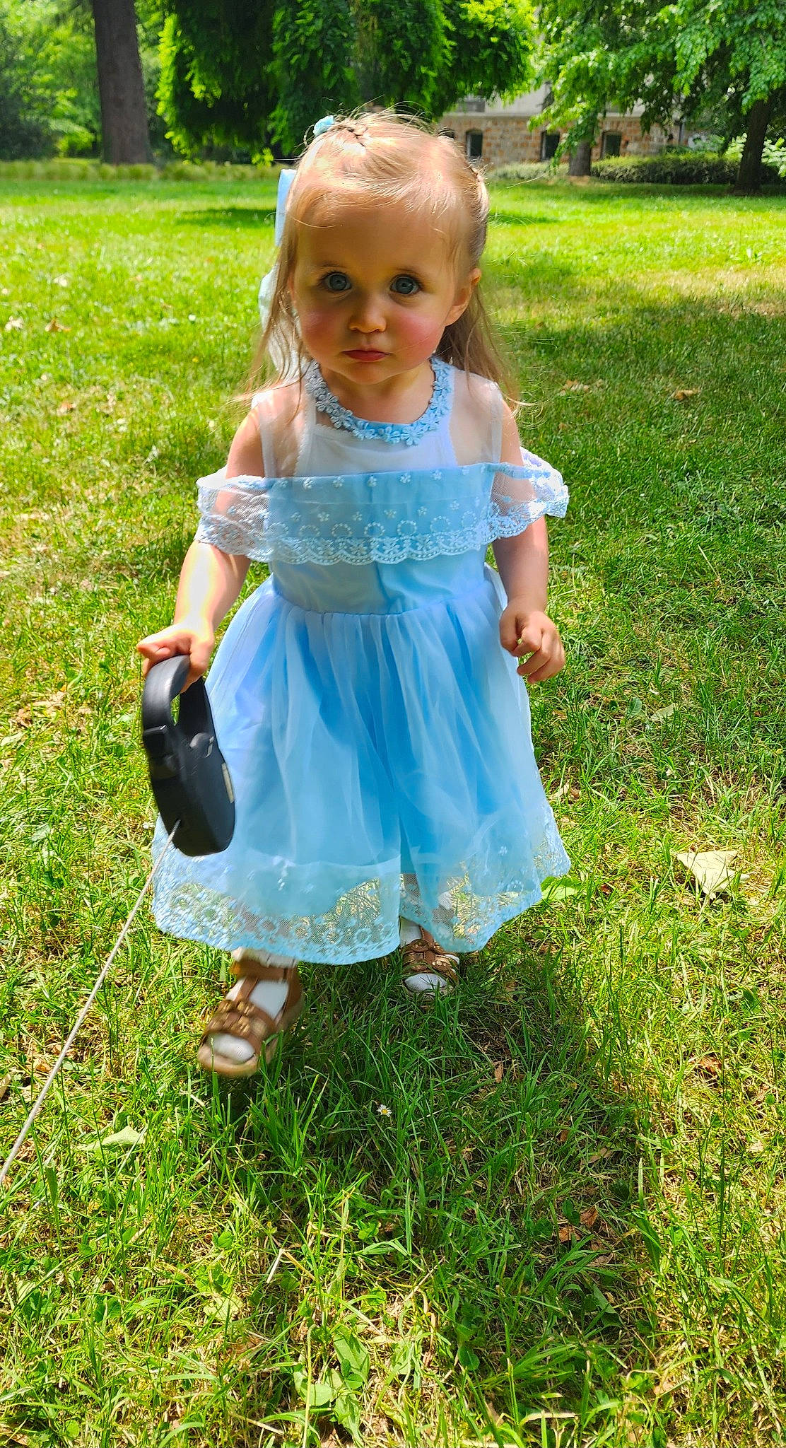 Thaïs participe au concours pour gagner de l'argent avec cette photo : baby_toddler_clothing, day_dress, dress, electric_blue, grass, grass_family, grassland, green, happy, lawn, meadow, one_piece_garment, pattern, people_in_nature, person, plant, recreation, sandal, shoe, toddler