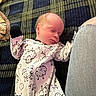 newborn, baby, sleeping, infant, portrait, onesie, sheep_pattern, socks, blanket, plaid, cozy, indoors, lying_down, peaceful, face, closed_eyes, clothing, adult, home, nap