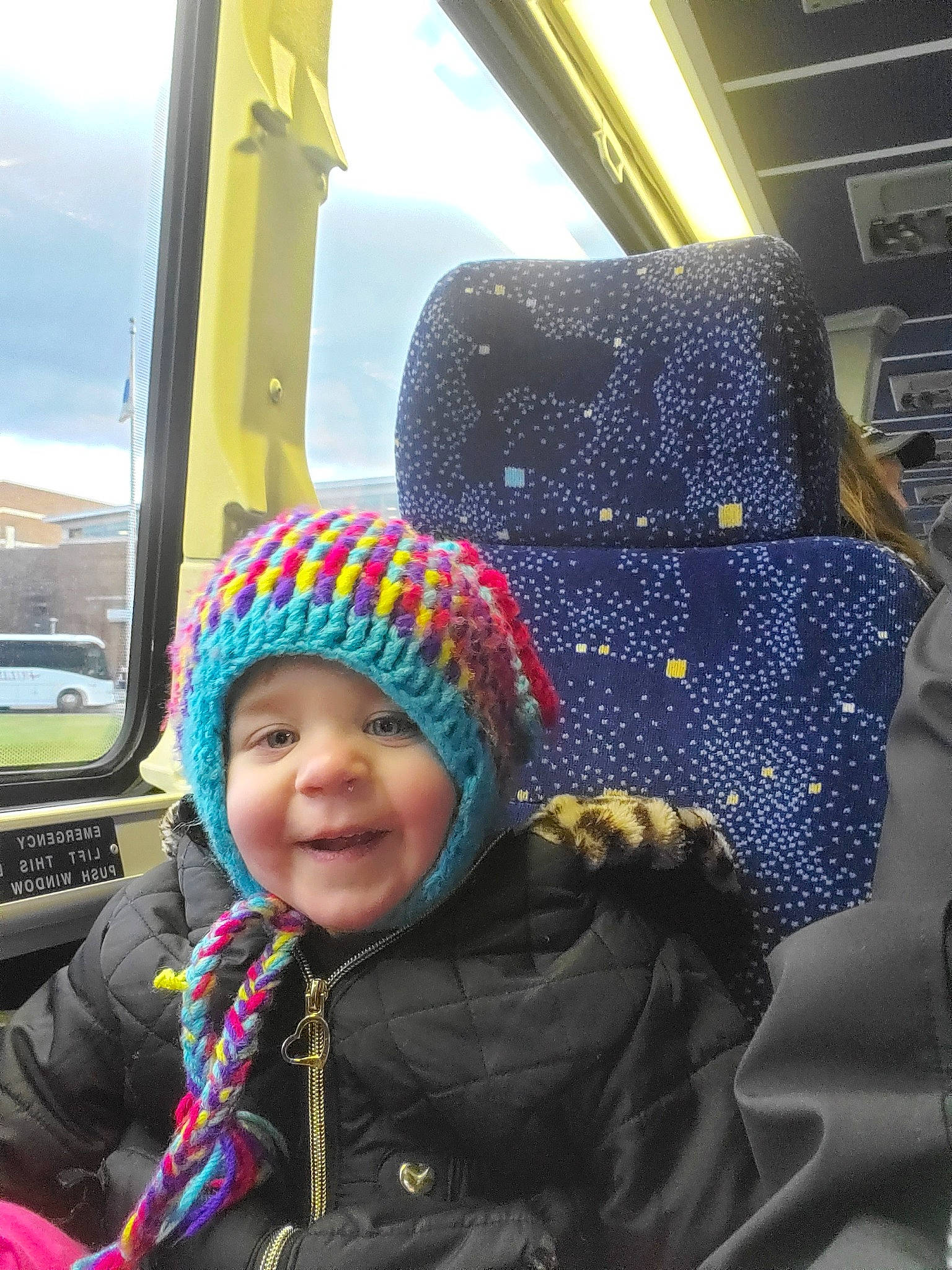 Mattie joined the competition — help win amazing prizes! beanie, bonnet, cap, child, fashion_accessory, fun, hat, headgear, headwear, knit_cap, knitting, person, smile, snow, toddler, vacation, winter
