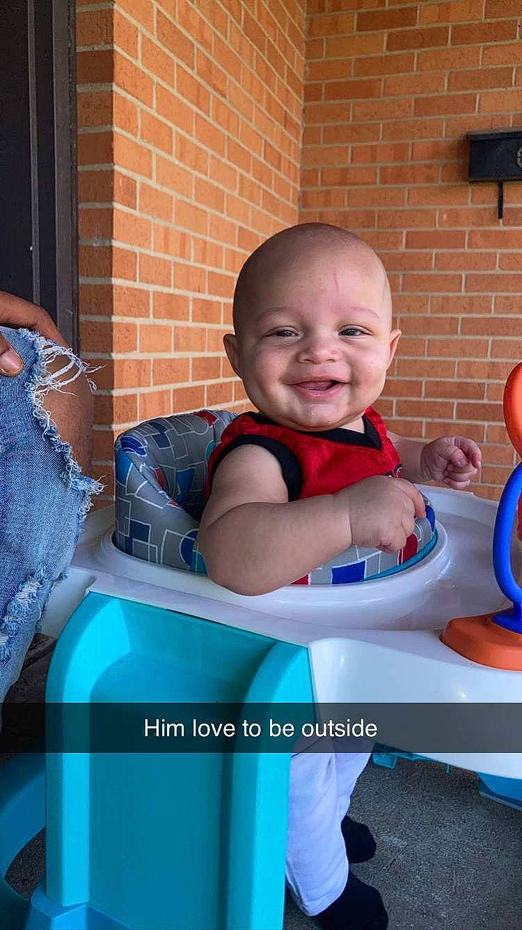 Keion joined the competition — help win amazing prizes! baby, baby_products, baby_toddler_clothing, blue, brick, brickwork, child, comfort, electric_blue, flash_photography, fun, happy, joy, leisure, person, photo_caption, sitting, sleeve, smile, t_shirt