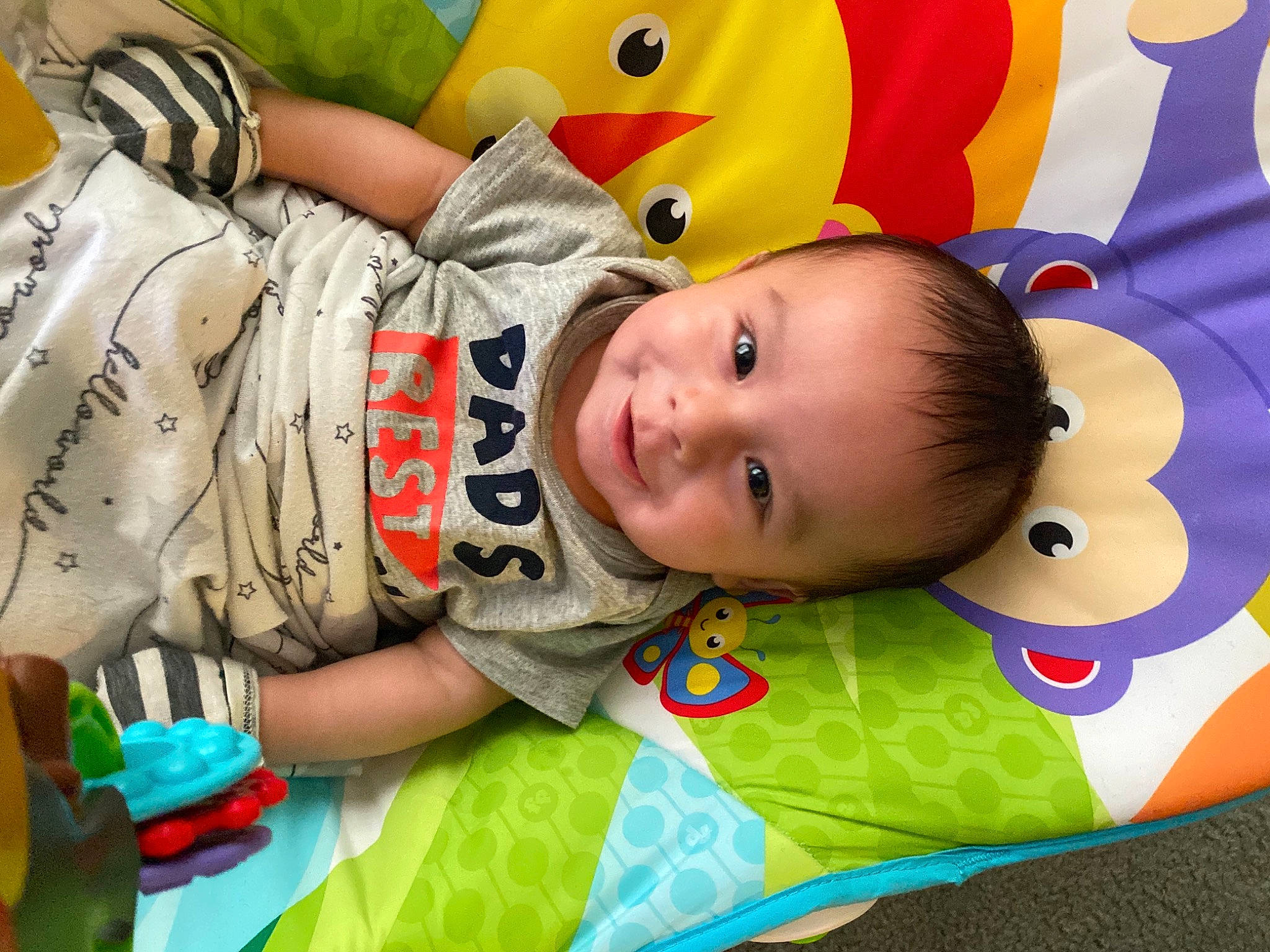 Matthias is registered to the contest to win money with this photo: baby, baby_products, baby_toddler_clothing, baby_toys, cheek, child, face, facial_expression, fun, green, happy, joy, leisure, linens, mammal, people, person, product, room, smile
