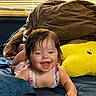 baby, bed, blanket, blue, brown, child, clothing, cozy, cute, face, hair, happy, indoor, infant, person, plush_pillow, smiling, toddler, window_blinds, yellow