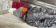 Raphaël participe au concours pour gagner de l'argent avec cette photo : newborn, baby, hospital, blanket, hat, sleeping, bassinet, infant, cozy, soft, face, person, bed, rest, cute, child, indoors, peaceful, wrapped, portrait