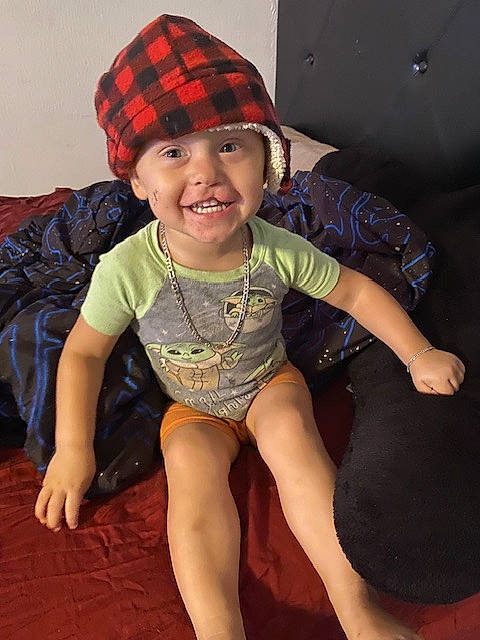 Branden is registered to the contest to win money with this photo: baby_toddler_clothing, cap, child, chin, cool, eye, face, happy, head, headwear, human_body, human_leg, joy, knee, pattern, person, skin, sleeve, smile, t_shirt