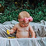 Alattica is registered to the contest to win money with this photo: baby, child, pink_bow, headband, lemon_slice, greenery, outdoor, nature, sheet, makeshift_tub, cute, curious, chubby, skin, infant, summer, playful, sitting, water, portrait