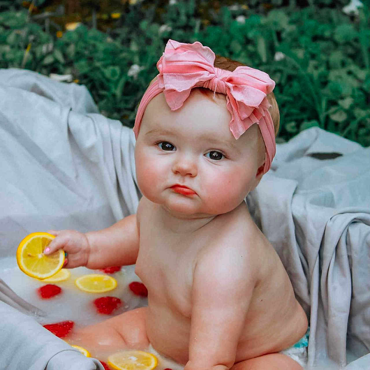 Alattica joined the competition — help win amazing prizes! baby, bath, blanket, child, chubby, cute, fabric, fruit, greenery, headband, infant, lemon_slices, outdoor, pink_bow, raspberries, serious_expression, sitting, skin, summer, water