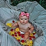 baby, infant, milk_bath, lemon_slices, strawberries, pink_bow, headband, skin, outdoor, greenery, gray_fabric, fruit, water, cute, child, portrait, summer, natural_light, sitting, playful