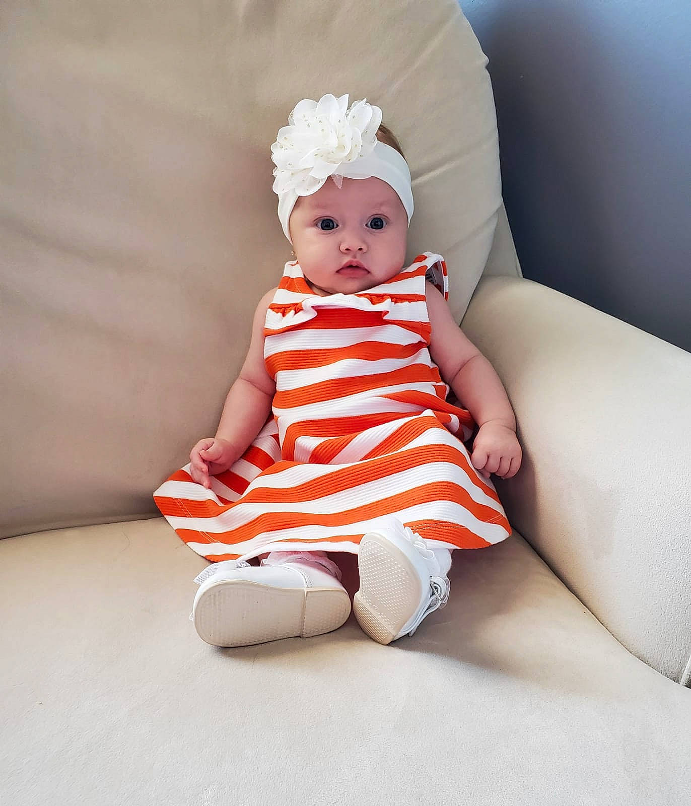 Sophie joined the competition — help win amazing prizes! baby, baby_toddler_clothing, carmine, child, comfort, costume_hat, day_dress, dress, embellishment, fashion_accessory, fashion_design, headwear, human_leg, knee, one_piece_garment, pattern, person, sitting, sleeve, sock