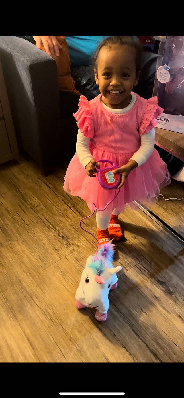 Indira is registered to the contest to win money with this photo: architecture, building, child, clothing, couch, dress, face, female, furniture, girl, hardwood, head, indoors, interiordesign, livingroom, person, photography, portrait, toy, wood