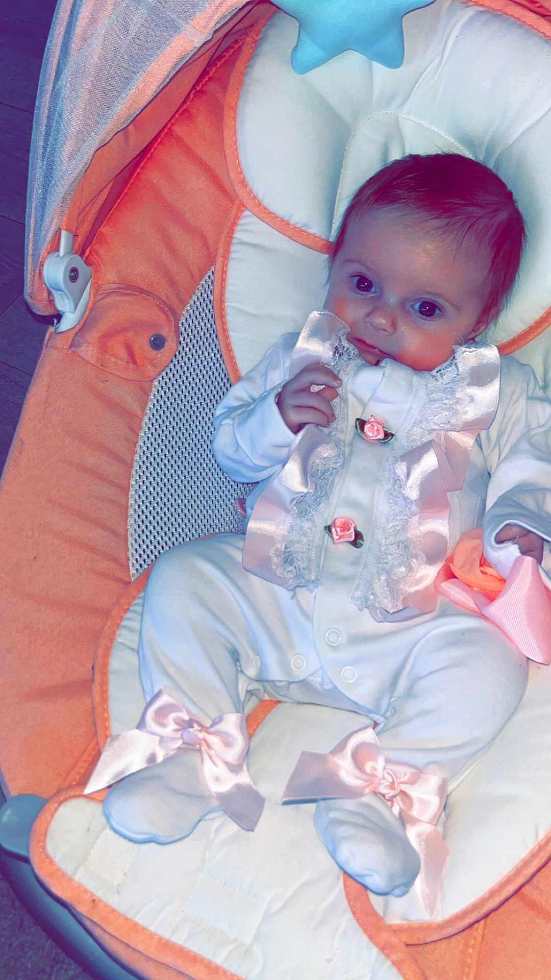 Ivy-Jayne is registered to the contest to win money with this photo: baby, infant, child, baby_seat, orange, white, pink_bows, clothing, cute, portrait, indoor, fabric, soft_toys, face, sitting, newborn, baby_girl, lace, ribbons, footwear