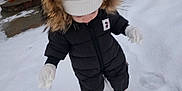 Keira joined the competition — help win amazing prizes! boots, child, cold_weather, curious, exploring, footprints, fur_hood, hat, mittens, outdoor, person, playful, puffer_jacket, snow, snowy_ground, standing, toddler, white_snow, winter, winter_clothing