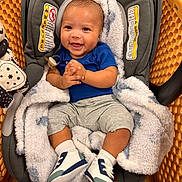 Nyaire joined the competition — help win amazing prizes! baby, infant, car_seat, shopping_cart, blanket, smile, happy, footwear, socks, clothing, person, indoor, child, cute, baby_shoes, seat, plush, face, hands, portrait