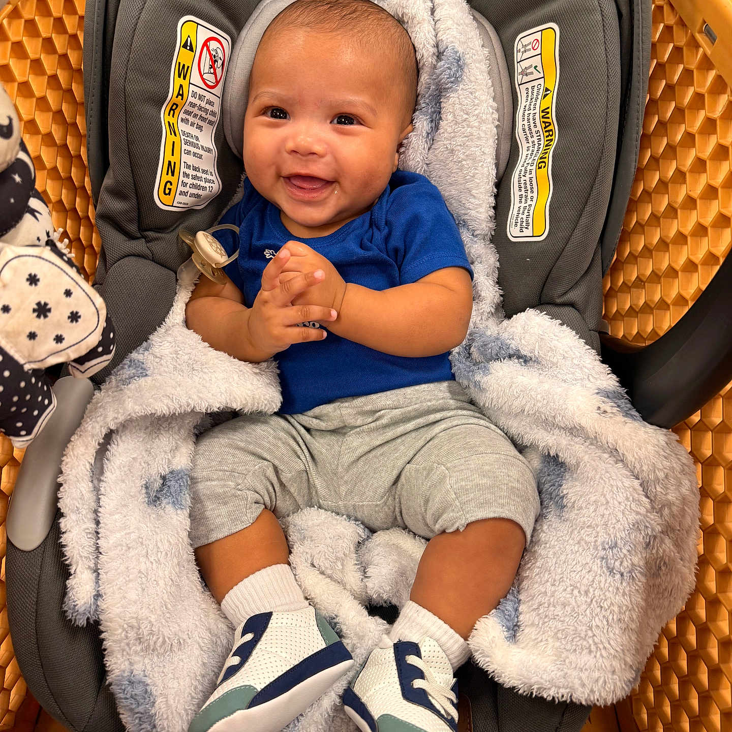 Nyaire joined the competition — help win amazing prizes! baby, infant, car_seat, shopping_cart, blanket, smile, happy, footwear, socks, clothing, person, indoor, child, cute, baby_shoes, seat, plush, face, hands, portrait