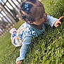 Anaiah joined the competition — help win amazing prizes! toddler, child, grass, outdoor, blue_clothing, hair_clips, curly_hair, nature, exploring, ruffled_sleeves, floral_pants, fence, greenery, cute, baby, playful, portrait, daylight, smiling, hands