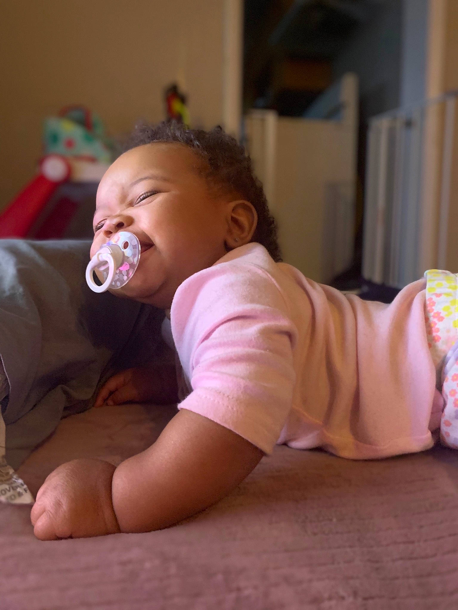 Phoenix joined the competition — help win amazing prizes! baby, baby_toddler_clothing, cheek, chin, comfort, facial_expression, finger, floor, flooring, human_body, joint, leg, mouth, nose, person, pink, skin, sleeve, smile, toddler