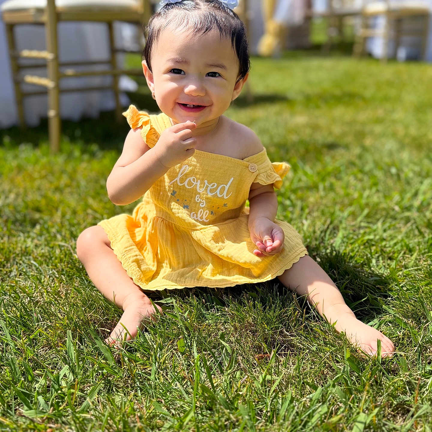 Anuhea is registered to the contest to win money with this photo: baby, backyard, bodypart, clothing, dress, face, finger, grass, hand, head, lawn, nature, outdoors, person, photography, plant, portrait, sitting, summer, yard