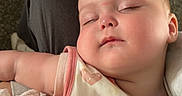 Jensen joined the competition — help win amazing prizes! baby, sleeping, blanket, child, person, indoor, carpet, toy, tricycle, plush_toy, clothing, head, face, comfort, rest, nap, soft, cute, peaceful, lap