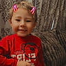 Alakai joined the competition — help win amazing prizes! child, smile, red_shirt, monkey_graphic, digital_filter, devil_horns, couch, blanket, curtains, indoors, young_child, happy, person, seated, cozy, home, casual, portrait, cute, playful