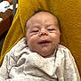 Janël participe au concours pour gagner de l'argent avec cette photo : baby, infant, blanket, smile, face, head, hair, cozy, yellow, textile, clothing, newborn, portrait, cute, soft, lying, indoors, young, skin, expression