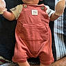 Robert is registered to the contest to win money with this photo: baby, blanket, child, clothing, curious, cute, foot, hat, indoor, infant, leg, looking, lying_down, mittens, person, resting, romper, socks, striped, young