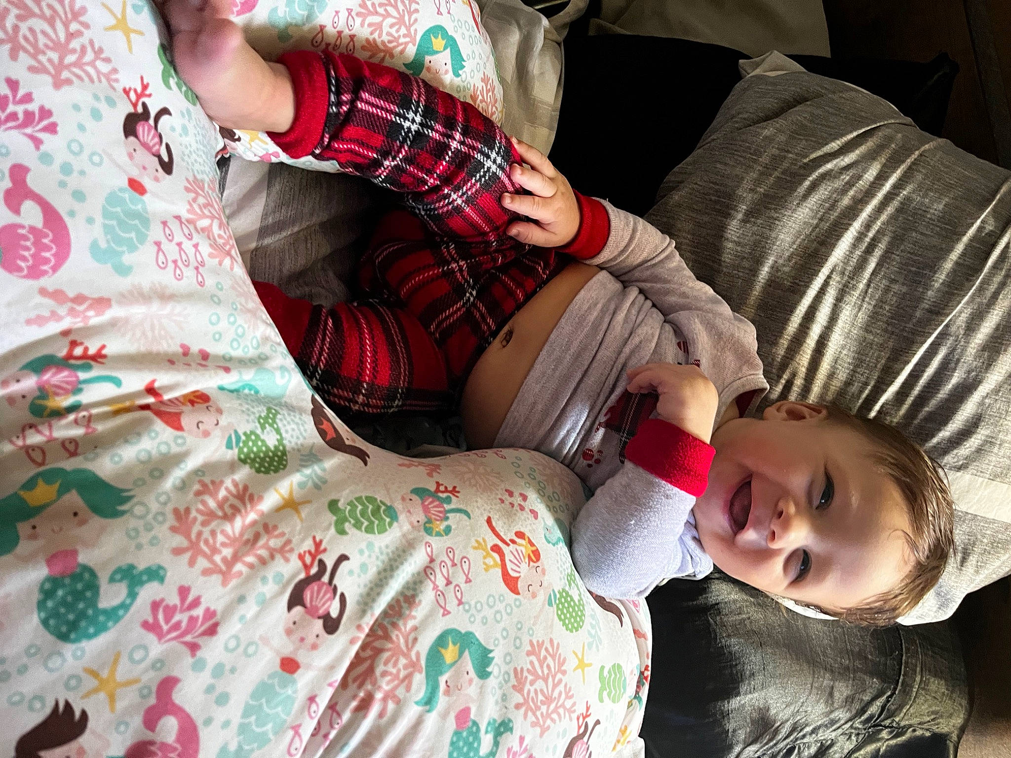 Kyri joined the competition — help win amazing prizes! bed_sheet, bedding, child, comfort, couch, eyewear, human_leg, linens, magenta, nap, pattern, person, pillow, plaid, room, sitting, sleep, tartan, textile, thigh